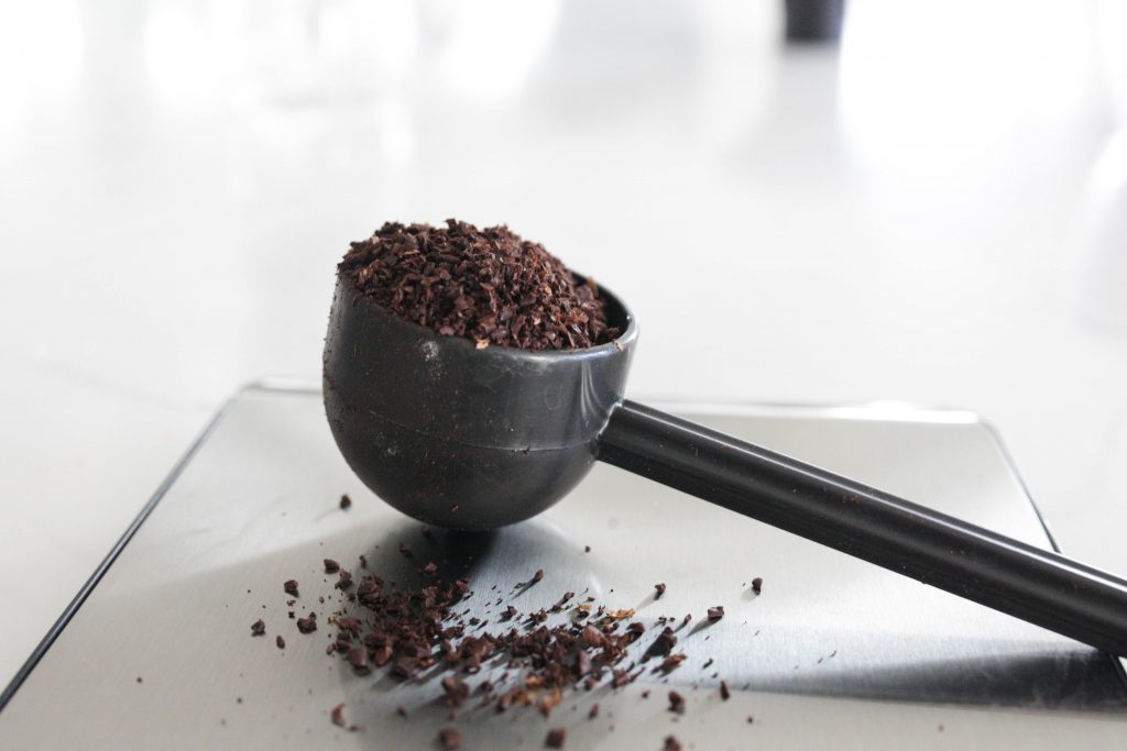 ground coffee in a spoon