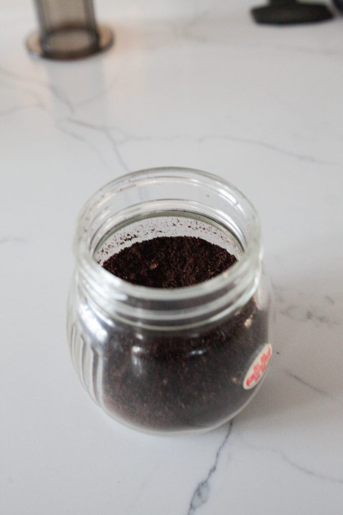 Ground coffee beans in a jar