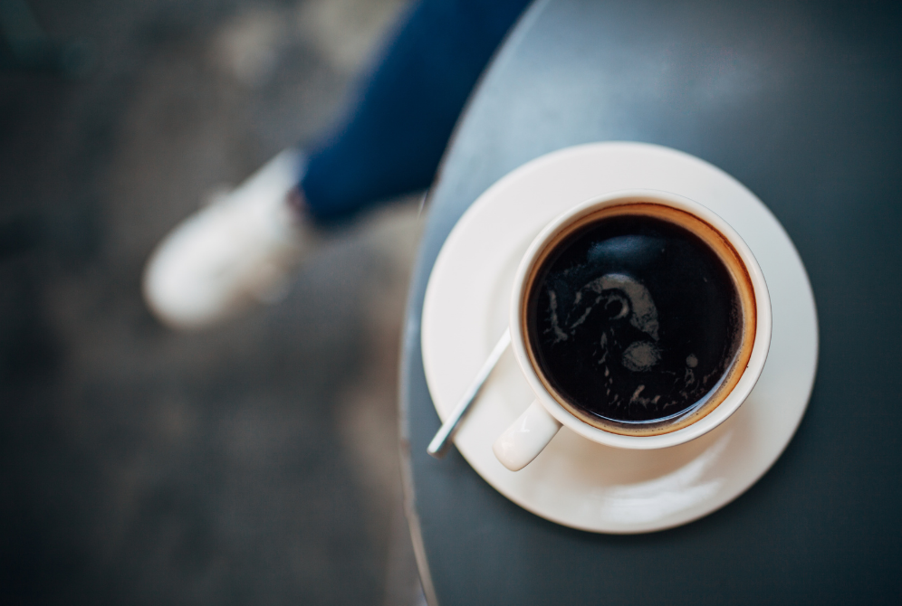 cup of coffee in white mug on table