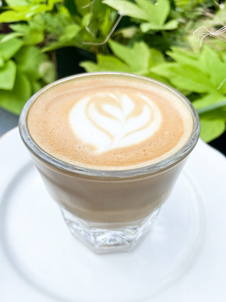 cortado drink on white plate