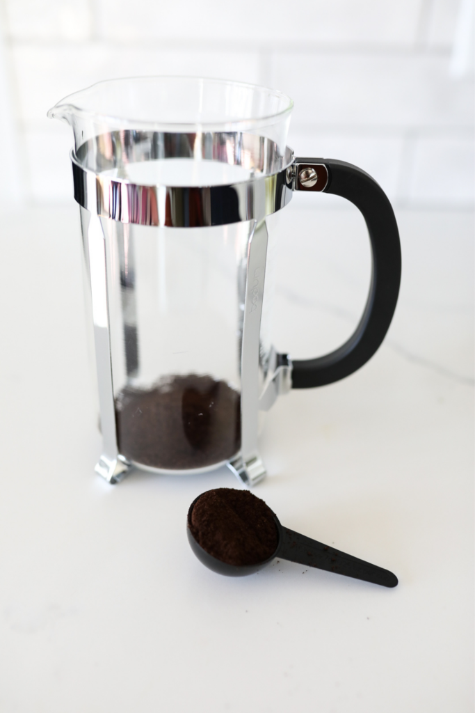 French press on a white counter 