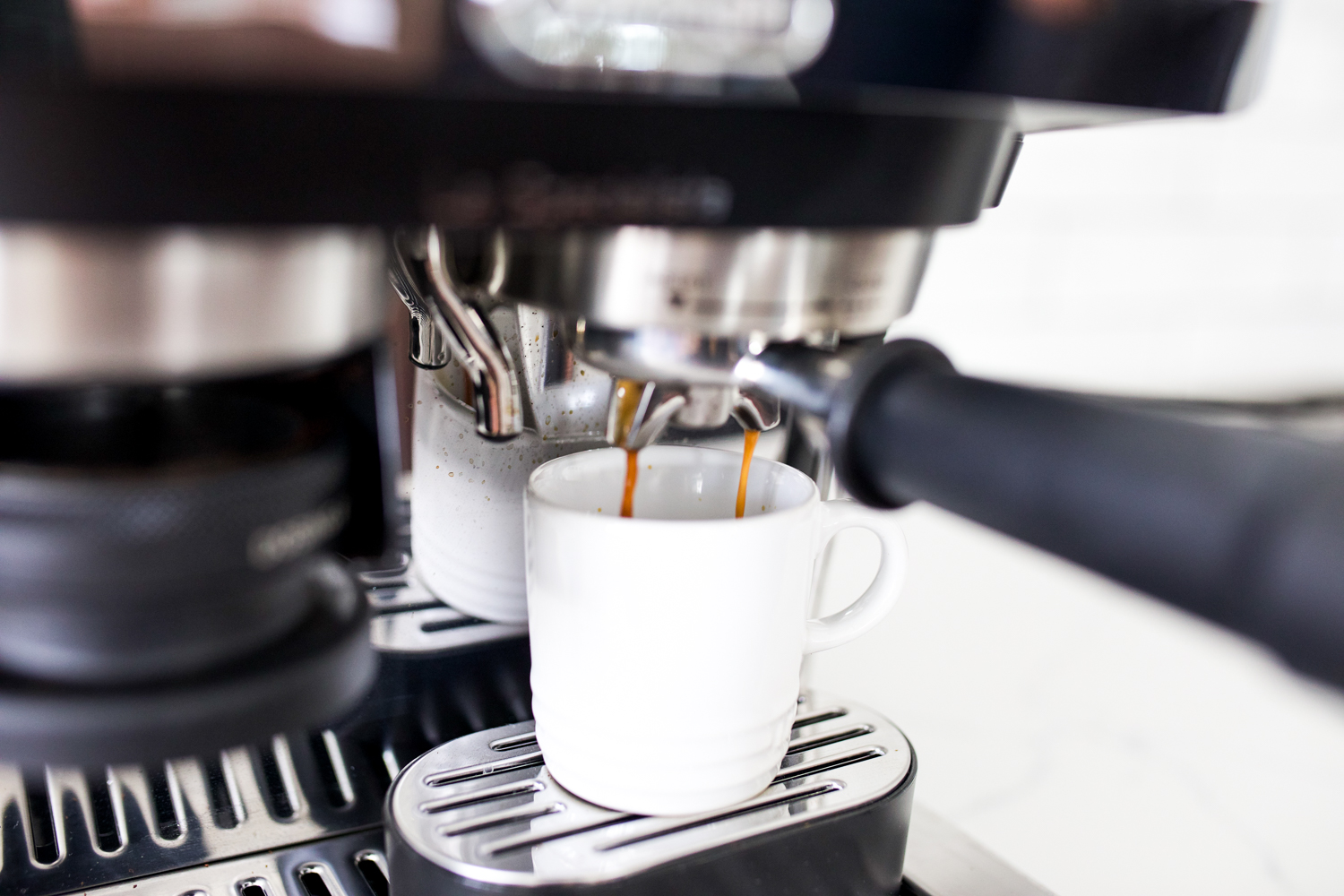 espresso pouring into a cup