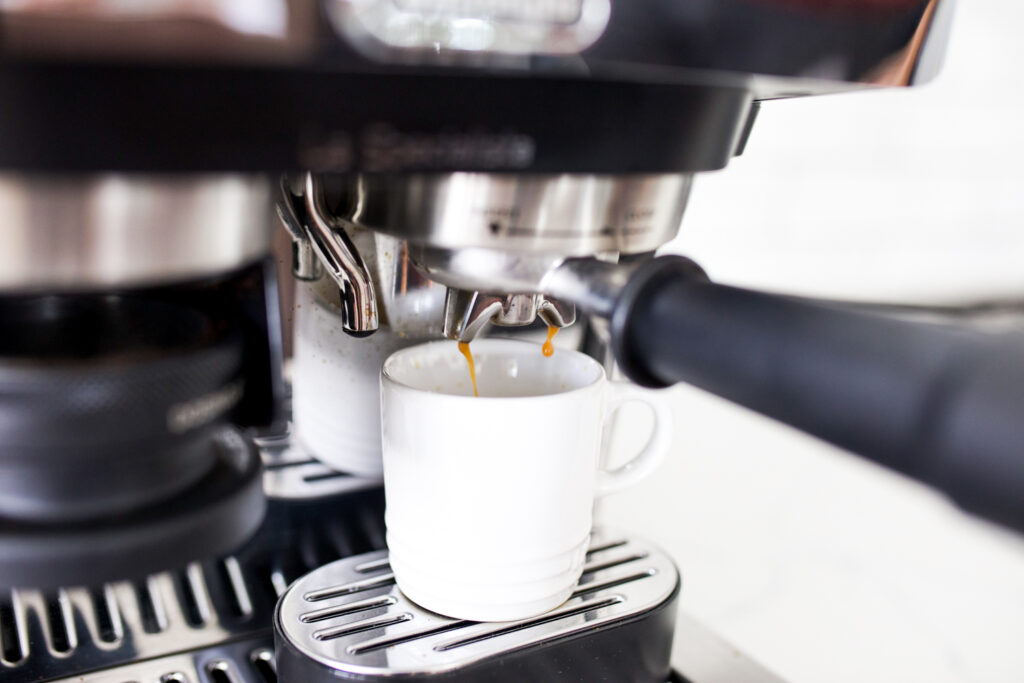 espresso pouring into a cup