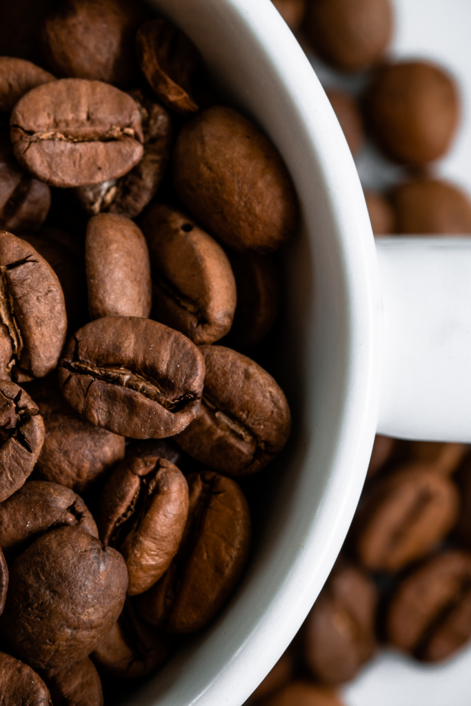 close up of coffee beans in cup